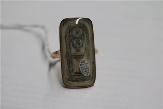 An early 19th century yellow metal and ivory mourning ring,